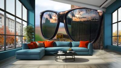 Sunset Reflecting in a Pair of Sunglasses Wall mural