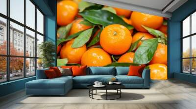 The orange leaves of a satsuma mandarin are shown closeup Wall mural