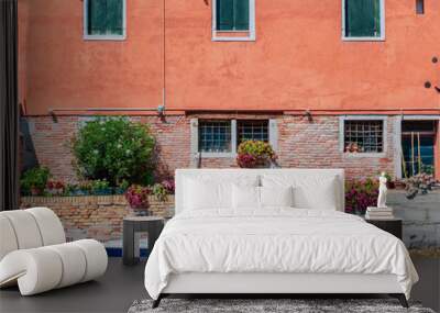 Boat and Venetian building by canal in Venice, Italy Wall mural