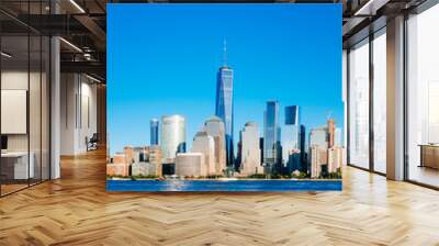 Skyline of downtown Manhattan over Hudson River under blue sky, at sunset, in New York City, USA Wall mural