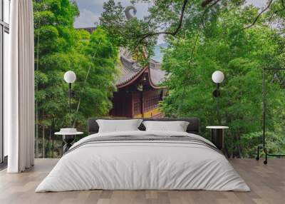 Traditional Chinese architecture among bamboos and trees, in Lingyin Temple, Hangzhou, China Wall mural