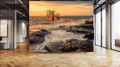 Blackrock diving board in Galway city, Ireland. Popular city landmark by the ocean with beautiful viewpoint on top. Travel and tourist hotspot. Sport and entertainment. Dramatic sunrise light. Wall mural