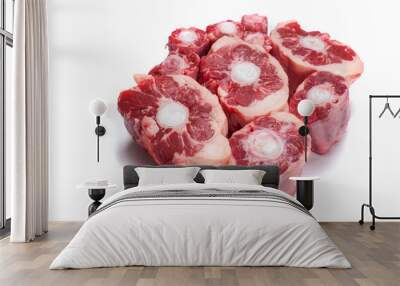 Fresh uncooked ox tail portions on white background. Meat industry product. Wall mural