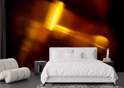 Light orange warm color light leak on dark background for design use and special effects. Abstract shape. Wall mural