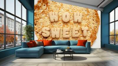 Sign wow sweet on a top of a pancake or crepes. Popular simple multi national food known for its taste and flavoring options. Wall mural