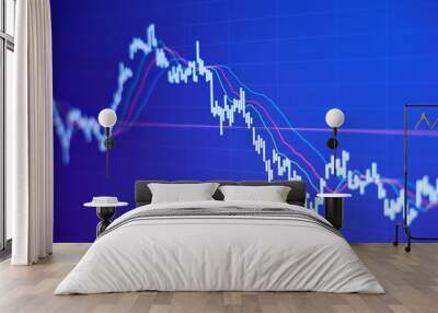 Falling stock market chart on blue background Wall mural