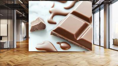 A melting chocolate bar with rich glossy chocolate drips, creating tempting and indulgent scene. smooth texture and rich color invite delightful experience Wall mural