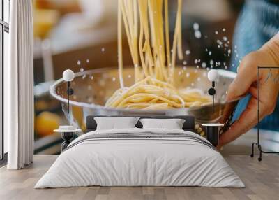 Freshly cooked spaghetti being drained in a colander over a sink Wall mural