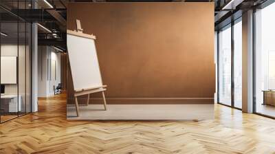  Wooden easel with white blank canvas with copy space against brown venetian stucco wall. Home interior design of modern living room Wall mural