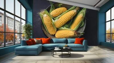 Corn in a bowl on a black background Wall mural