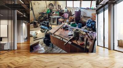 Workshop scene, interior of an old dirty garage full of stuff. Old messy mechanics workshop with different types of scattered tools. Wall mural