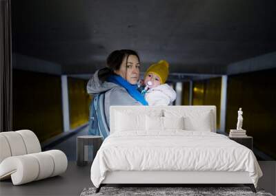 Frightened mother and her child in the underground shelter Wall mural