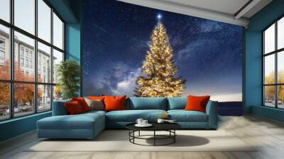 Holiday background with illuminated Christmas tree under starry night sky Wall mural