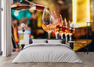 Service Serving Pouring Wine in shiny glasses in bar restaurant night club Wall mural