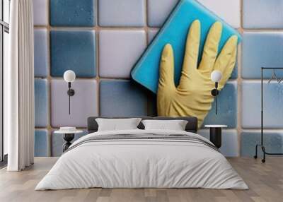 rubber glove sponges the tiles in the bathroom Wall mural