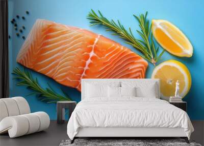 salmon fillet with lemon and rosemary on blue background Wall mural