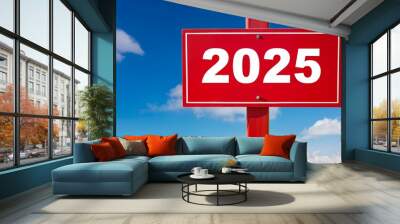 Text 2025 on red sign against blue sky  Wall mural