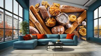 Various Types of Pasta and Bread Arranged on a Grey Background Wall mural