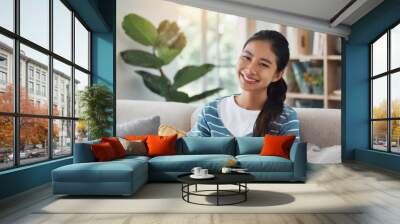 Woman, smile and portrait for relax and happy in home or indoor on weekend and alone on break and joy. Young person and attractive for peace, rest or chill in living room or house on sofa on mockup Wall mural