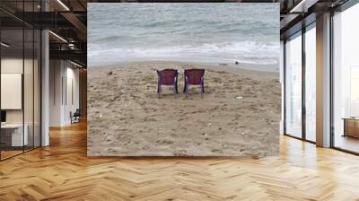 Two Purple Plastic Chairs at Polluted Beach Mediterranean Sea Wall mural