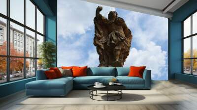 Statue of a holy man holding a vessel. Wall mural