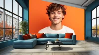 close-up portrait photography of a satisfied boy in his 20s wearing a casual t-shirt against a brigh Wall mural