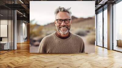 Headshot portrait photography of a satisfied mature man wearing a cozy sweater against a picturesque desert oasis background. With generative AI technology Wall mural