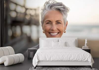 Medium shot portrait photography of a happy mature woman wearing a casual short-sleeve shirt against a picturesque beach boardwalk background. With generative AI technology Wall mural