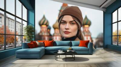 Medium shot portrait photography of a merry girl in his 30s wearing a sophisticated pillbox hat in front of the saint basils cathedral in moscow russia. With generative AI technology Wall mural