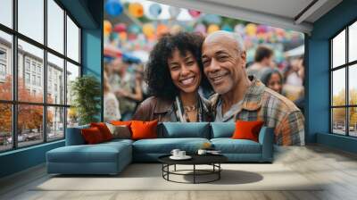 Portrait of a blissful mixed race couple in their 40s sporting a stylish leather blazer over vibrant festival crowd Wall mural