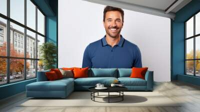 Portrait of a happy man in his 30s wearing a sporty polo shirt in white background Wall mural