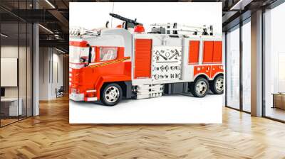 Toy fire engine with fire hose and fire extinguishing tools. Children's toy plastic big car with isolated on white background Wall mural