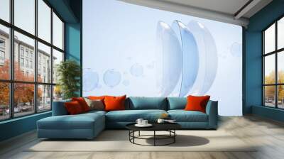 contact lenses in water surface with air bubbles on blue background. eye lens cleaning solution conc Wall mural