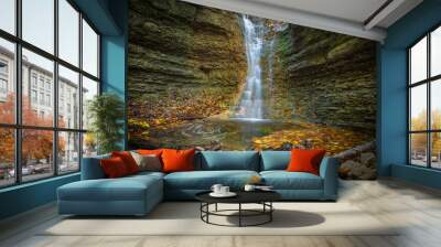 A small waterfall in rautal close to jena in thuringia at autumn Wall mural