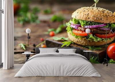 A healthy fast food option: a vegan rye burger topped with fresh vegetables, presented on an old wooden background. Wall mural