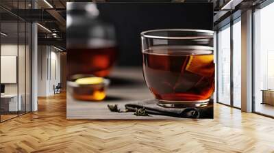 Cup of black tea on the table Wall mural