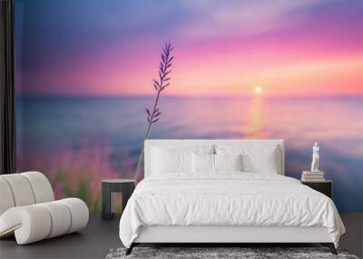 little grass stem close up with sunset over calm sea sun going down over horizon pink and purple pastel watercolor soft tones beautiful nature background Wall mural