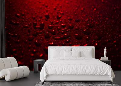 water drops on a plastic red background in the dark Wall mural