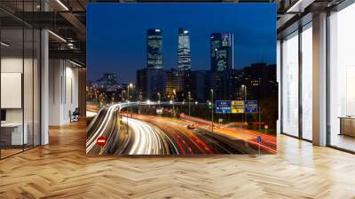  Night photo of the 4 towers in Madrid. Night photo of urban traffic with illuminated buildings. Wall mural