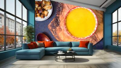 Vegetable puree soup and croutons on table Wall mural