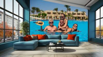 Real people concept, beautiful family, two teenage girls, mother and father swimming and having fun in pool in vacation. happiness and nice body for enjoyed people live an lifestyle as vacation Wall mural