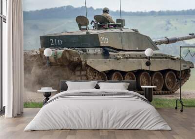 A British army Challenger 2 ii FV4034 Main Battle Tank travelling at speed in action on a military exercise, Wiltshire UK Wall mural