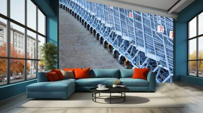 A row of shopping carts Wall mural