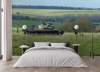 a soldier directing an FV4034 Challenger 2 II main battle tank across a field. Wilts UK Wall mural