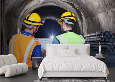 Workers reading blueprints in tunnel Wall mural