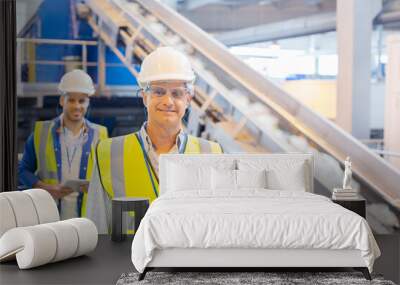 Workers smiling in recycling center Wall mural