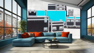 Group of black and blue flight cases on a concrete floor Wall mural