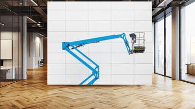 Modern blue hydraulic lift platform in front of a white tiled office wall Wall mural