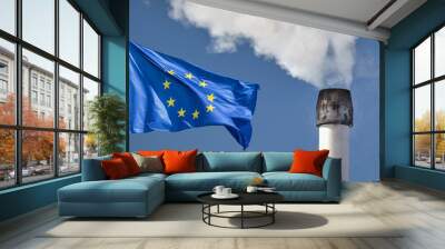 Waving European flag in front of a polluting factory chimney with smoke Wall mural