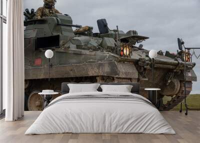 British army Warrior FV512 mechanized recovery vehicle tank in action on military battle exercise, Wiltshire UK  Wall mural